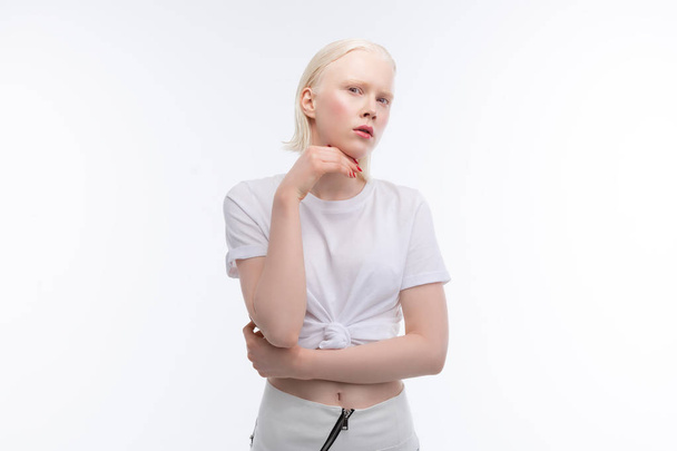 Skinny model with bob cut wearing skirt and short t-shirt - Fotoğraf, Görsel