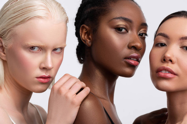 Portrait of three females with different complexion feeling confident - Foto, Imagem