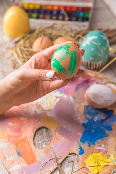 Easter composition with Easter eggs on wooden background - Photo, image