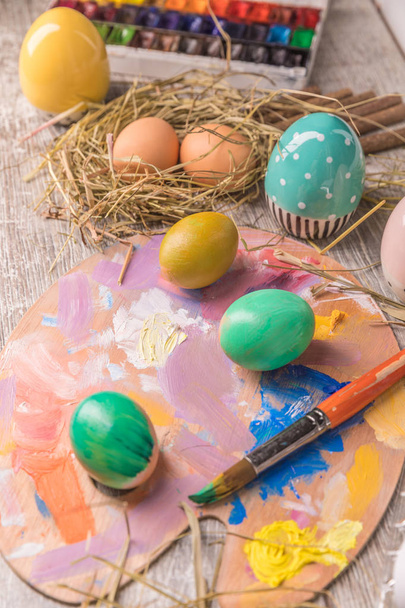 Easter composition with Easter eggs on wooden background - Fotoğraf, Görsel