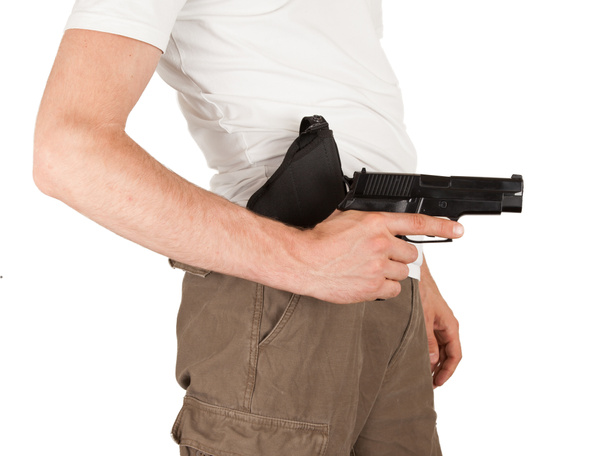 Gros plan d'un homme avec un étui et une arme
 - Photo, image