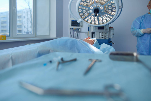 Man surgeon at work in operating room - Photo, image