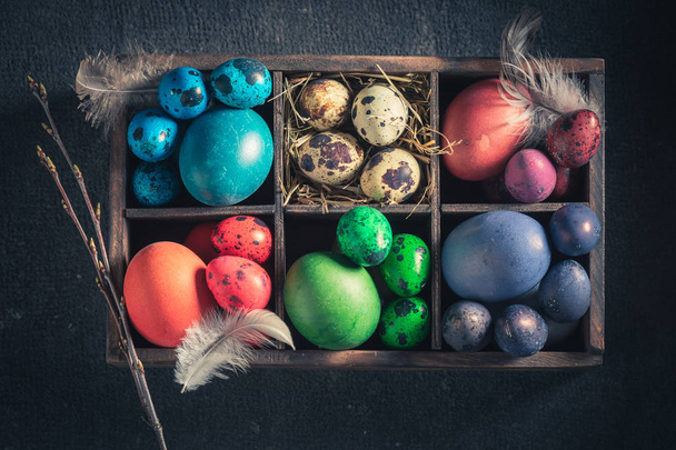 Top view of fresh Easter eggs in small wooden box - Foto, Bild