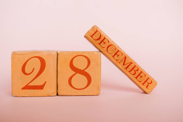 december 28th. Day 28 of month, handmade wood calendar  on modern color background. winter month, day of the year concept - Photo, image