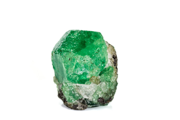 Macro stone garnet mineral, Uvarovite in rock on a white backgro - Photo, Image
