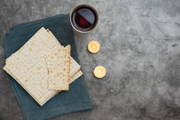 Red kosher wine with matza on a grey background. Top view. With copy space - Photo, Image