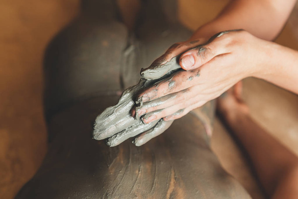 Medical procedure - massage with healing clay. Concept - healthy lifestyle - 写真・画像