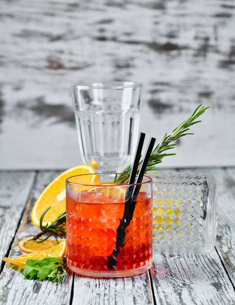 Negroni-Sprits. Alcoholic cocktail in a glass. On a wooden background. Top view. Free copy space. - Photo, image