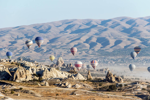 Cappadocia, Turkey - October 08, 2018: hot air balloons in blue sky in Goreme Cappadocia - Fotoğraf, Görsel