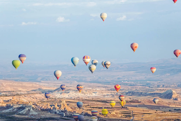 Cappadocia, Turkey - October 08, 2018: hot air balloons in blue sky in Goreme Cappadocia - Foto, Imagen