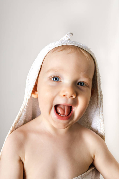 Funny baby boy in towel. - Фото, изображение