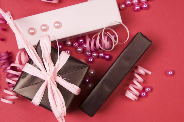 Gift boxes with bow on red background - Photo, Image