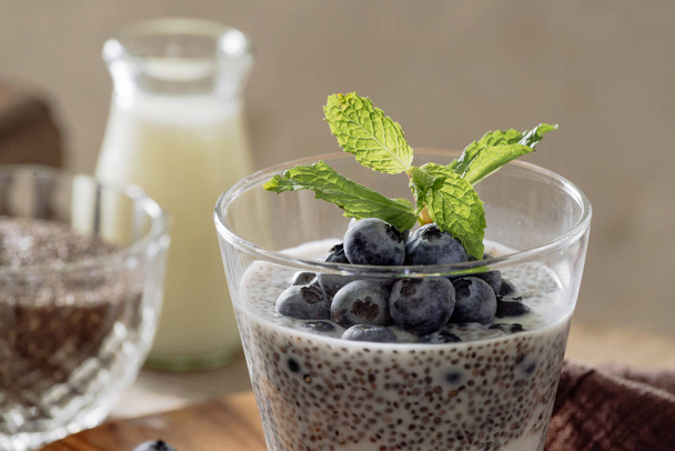 Chia pudding with fresh berries and almond milk. Superfood concept. Vegan, vegetarian and healthy eating diet with organic products - Photo, image