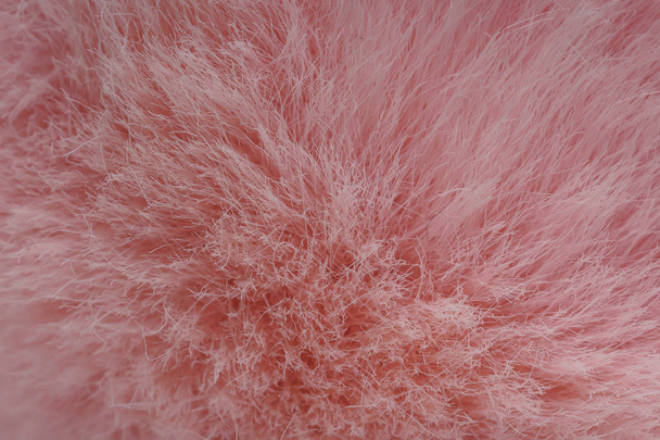 Texture of pink fur. Faux fur light pink color. Fluffy fabric - Photo, Image
