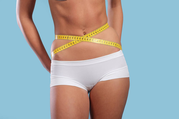 Woman measuring her slim body - Photo, Image