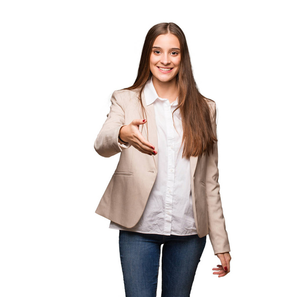 Young caucasian business woman reaching out to greet someone - Photo, Image