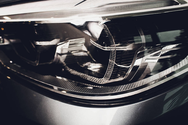 Macro view of modern blue car xenon lamp headlight. - Фото, зображення