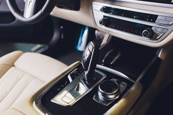 Car luxury inside. Interior of prestige modern car. Front seats with steering wheel. White cockpit. - Φωτογραφία, εικόνα