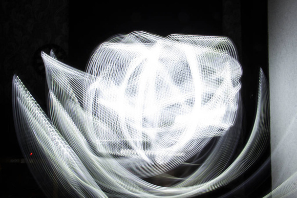 Beautiful bright abstract light pattern on black. - Photo, Image