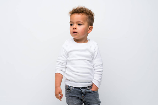 kid over isolated white background - Фото, изображение