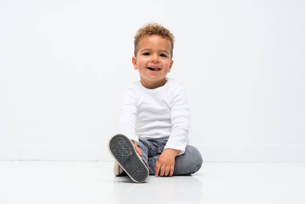 Happy kid over isolated white background - Photo, Image