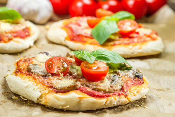 Close-up on freshly baked mini pizzas - Photo, Image