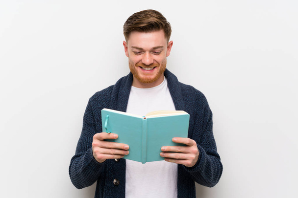 Redhead man reading a book - Photo, Image