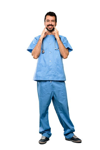 Full-length shot of Surgeon doctor man smiling with a happy and pleasant expression over isolated white background - Photo, Image