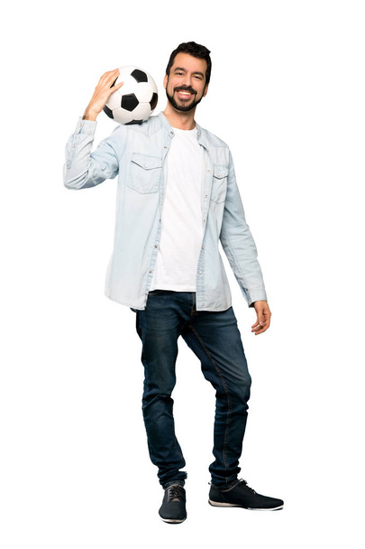 Full-length shot of Handsome man with beard holding a soccer ball over isolated white background - Zdjęcie, obraz
