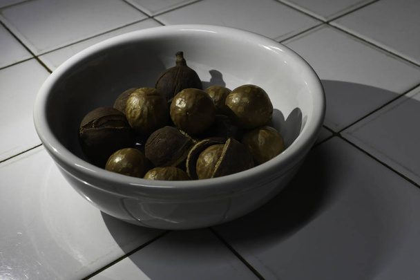Fresh Macadamia Tree Nuts In A Bowl - Photo, Image