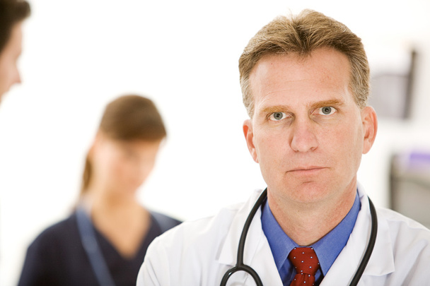 Doctors: Concerned Physician - Foto, afbeelding