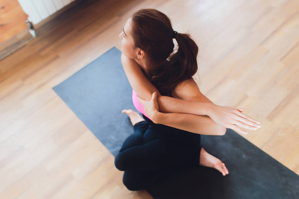 portrait of a young woman stretching hands. yoga. - Fotografie, Obrázek