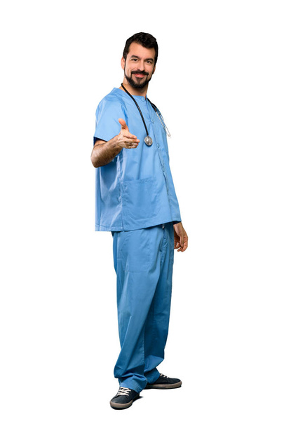Full-length shot of Surgeon doctor man shaking hands for closing a good deal over isolated white background - Foto, Bild