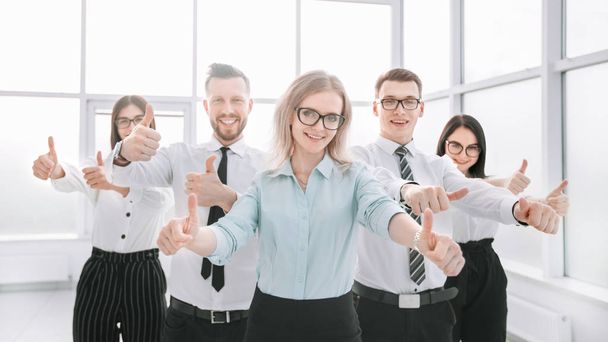 happy business team showing their thumbs up - Фото, зображення