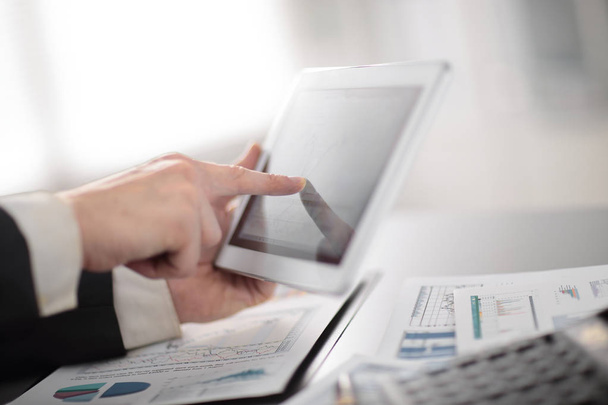 close up.businessman using digital tablet in the workplace - Φωτογραφία, εικόνα