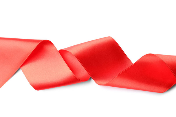 Simple red ribbon on white background, top view. Festive decoration - Fotó, kép