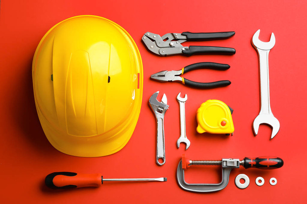 Flat lay composition with construction tools on color background - Фото, зображення