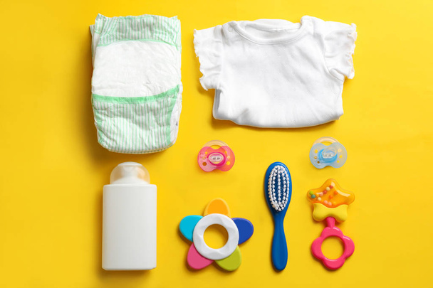 Flat lay composition with baby accessories on color background - Valokuva, kuva