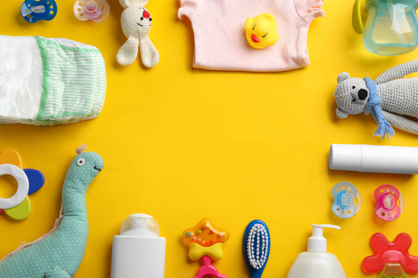 Flat lay composition with baby accessories and space for text on color background - Foto, Bild
