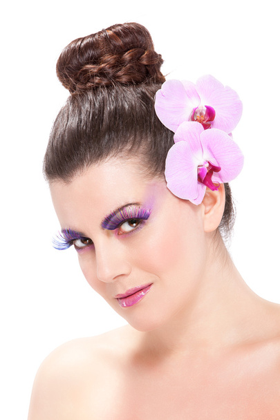 Beautiful Spring makeup with orchid flowers - Fotó, kép