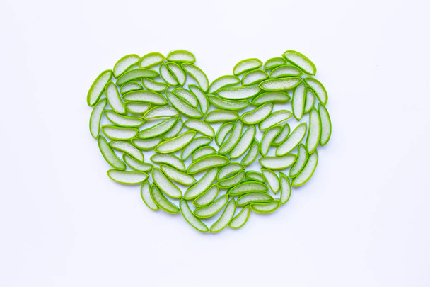 Heart shaped aloe vera slices on white  - Foto, Imagen