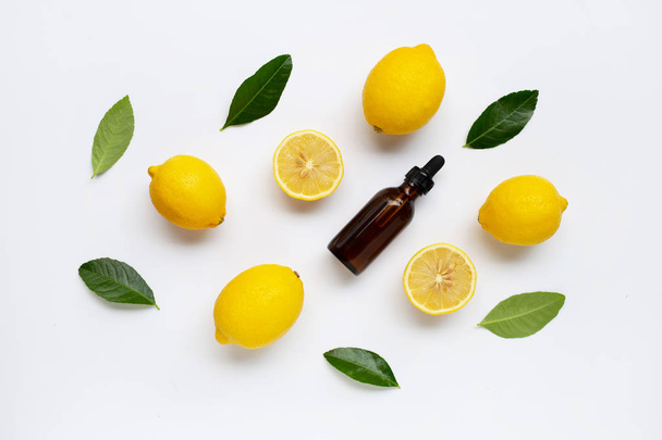 Fresh lemon with lemon essential oil on white background. - Φωτογραφία, εικόνα