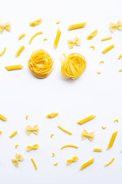 Different types of dry pasta on white. - Photo, Image