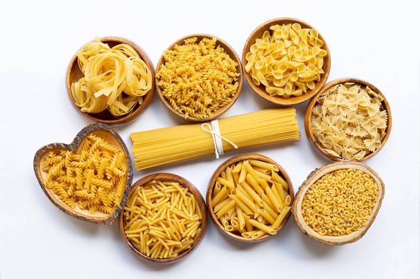 Different types of dry pasta on white. - Photo, Image