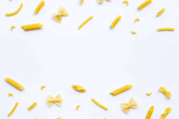 Different types of dry pasta on white. - Foto, Bild