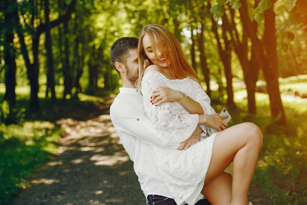 elegant couple in a forest - 写真・画像