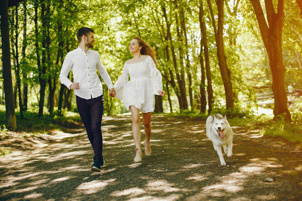 elegant couple in a forest - Photo, Image