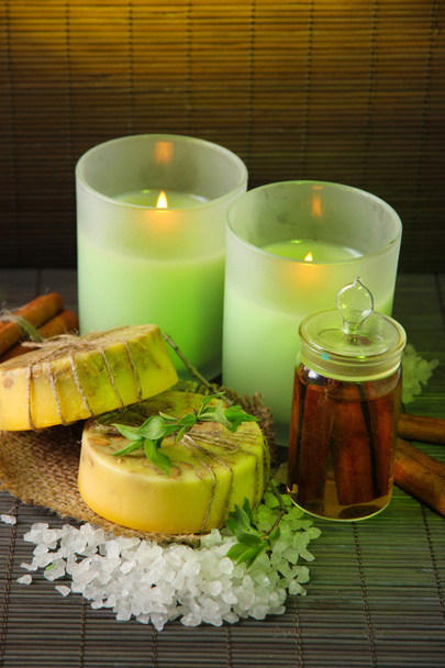 Hand made soap and candles on bamboo mat background - Foto, imagen