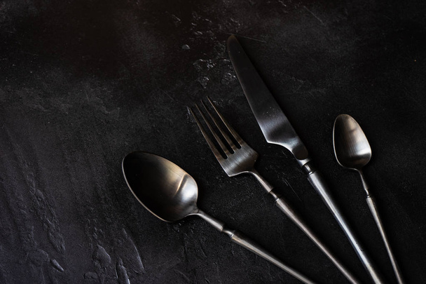 Cutlery set on rustic background - Photo, image