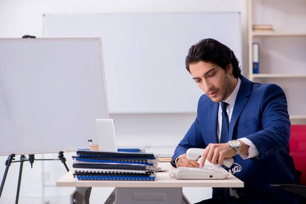 Young handsome businessman working in the office - Φωτογραφία, εικόνα